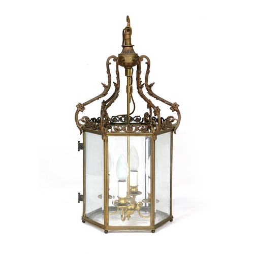 526 - French cast brass hexagonal hall lantern, circa 1900, centred with four candle lights and with clear... 