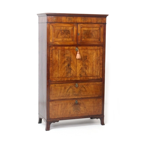 555 - George III mahogany secretaire a abbatant, circa 1780-1800, having two upper recessed panel cupboard... 