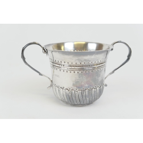 70 - Victorian silver porringer, London 1884, maker's mark indistinct, twin handled half reed form, heigh... 