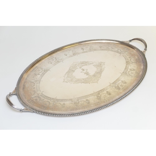 75 - Victorian silver plated oval serving tray, centred with a crest and a motto 'Mihi Solitudo Futuri' a... 