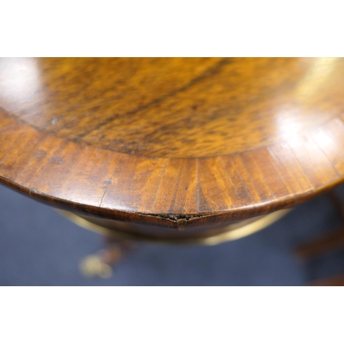 523 - Quality Regency rosewood work table, the satinwood banded lift up lectern top flanked on either side... 