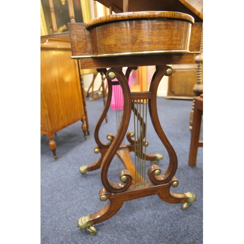 523 - Quality Regency rosewood work table, the satinwood banded lift up lectern top flanked on either side... 