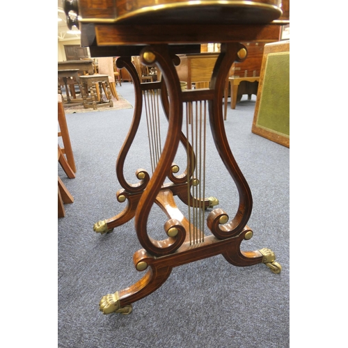 523 - Quality Regency rosewood work table, the satinwood banded lift up lectern top flanked on either side... 