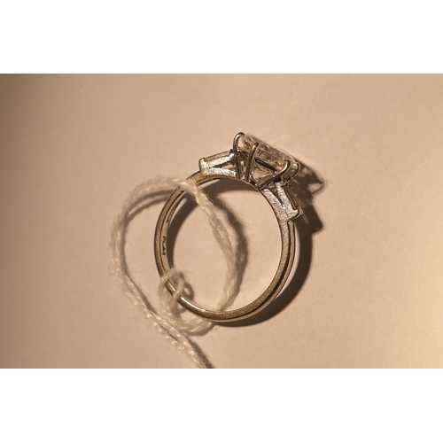 103 - Diamond three stone ring, centred with a round brilliant cut diamond of approx. 2.24cts, certificate... 