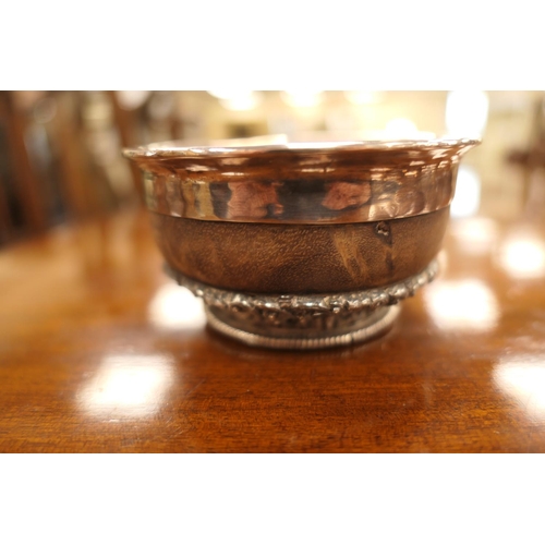 47 - Tibetan white metal mounted mazer bowl, late 19th Century, white metal lining, having an intricate b... 