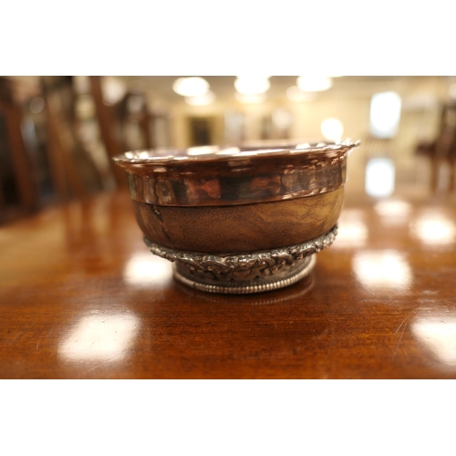 47 - Tibetan white metal mounted mazer bowl, late 19th Century, white metal lining, having an intricate b... 