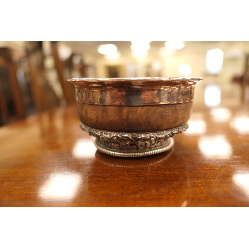 47 - Tibetan white metal mounted mazer bowl, late 19th Century, white metal lining, having an intricate b... 