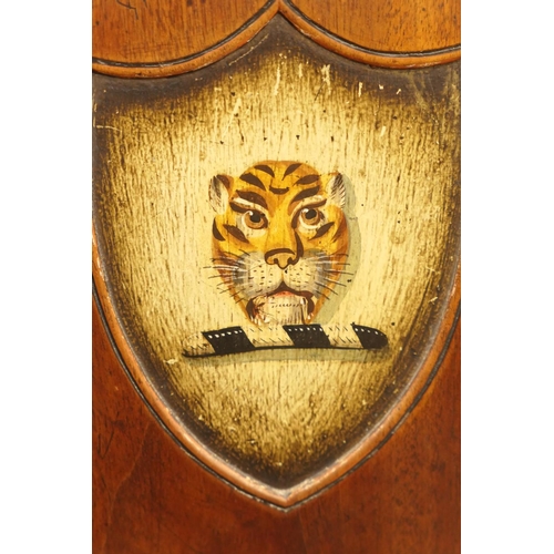 565 - Pair of George III mahogany armorial shield back hall chairs, circa 1790, the backs painted with a t... 