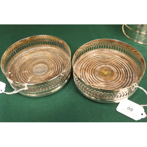 80 - Two pairs of modern silver bottle coasters, one pair Birmingham 1972, with turned wooden bases, 13.5... 