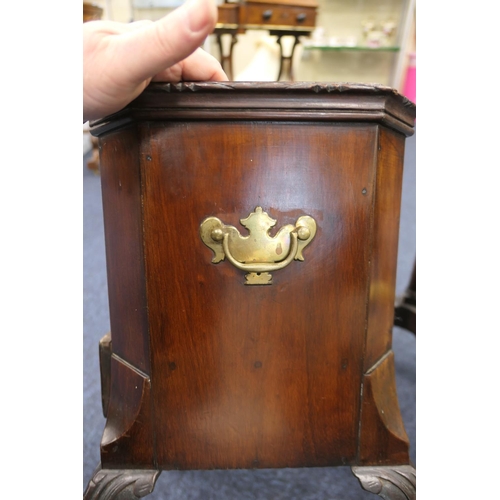 524 - Irish mahogany wine cooler, canted square form with brass carrying handles (liner deficient), fitted... 