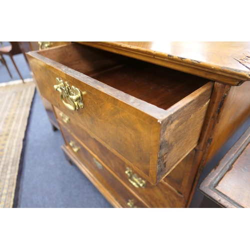 549 - Walnut chest of drawers, in part 18th Century with later restoration, fitted with two short and thre... 