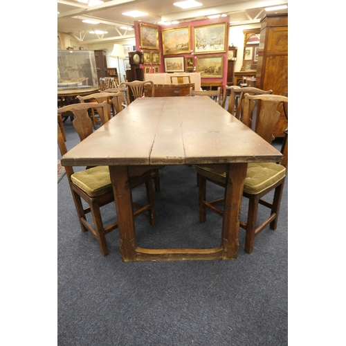 556 - Oak refectory table, Mid 17th Century and later, three plank top patinated and with some old graffit... 