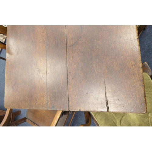 556 - Oak refectory table, Mid 17th Century and later, three plank top patinated and with some old graffit... 