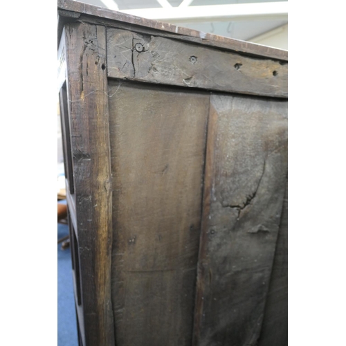 558 - Oak joined livery cupboard, mid 17th Century and later, having recessed panels with channel moulded ... 