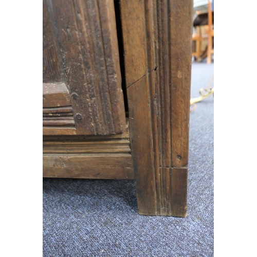 558 - Oak joined livery cupboard, mid 17th Century and later, having recessed panels with channel moulded ... 