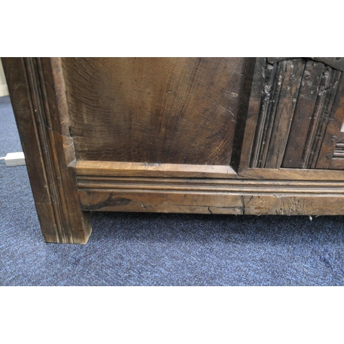 558 - Oak joined livery cupboard, mid 17th Century and later, having recessed panels with channel moulded ... 