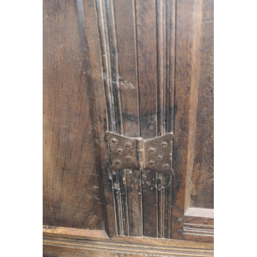 558 - Oak joined livery cupboard, mid 17th Century and later, having recessed panels with channel moulded ... 