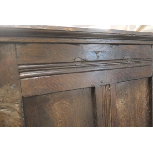 558 - Oak joined livery cupboard, mid 17th Century and later, having recessed panels with channel moulded ... 