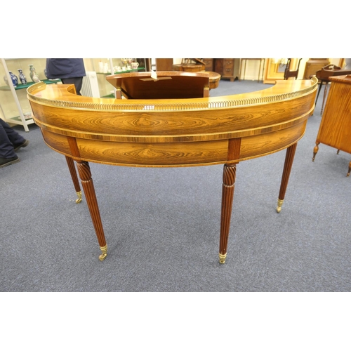 552 - William Tilman rosewood 'Regency' demi-lune writing table, having a brass galleried back fitted with... 