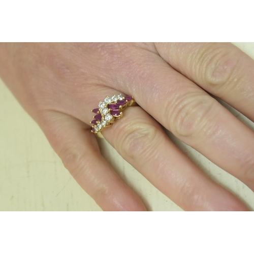 102 - Diamond and marquise ruby cluster ring, centred with nine brilliant cut diamonds totalling approx. 0... 