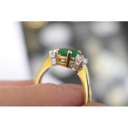 111 - Emerald and diamond three stone ring, the untested emerald of approx. 1ct, in a four claw mount, fla... 