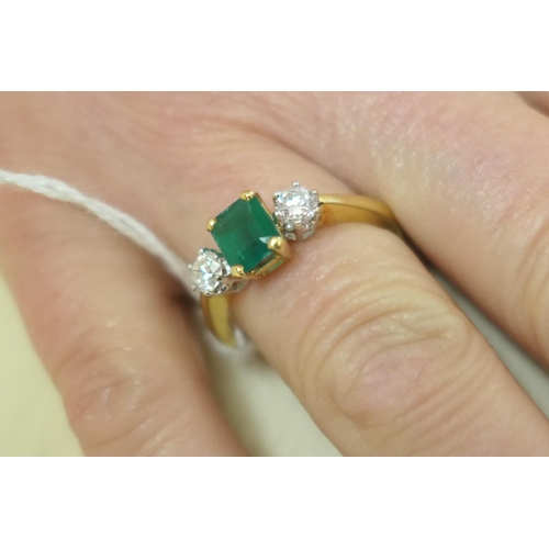 111 - Emerald and diamond three stone ring, the untested emerald of approx. 1ct, in a four claw mount, fla... 