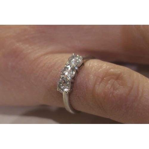 117 - Diamond three stone ring, by Mappin & Webb, the round brilliant cut stones well matched in colour an... 