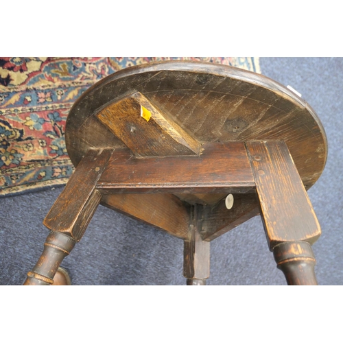 525 - Oak small cricket table, 19th Century, circular top on three turned legs united by a stretcher base,... 