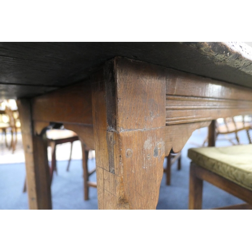 556 - Oak refectory table, Mid 17th Century and later, three plank top patinated and with some old graffit... 