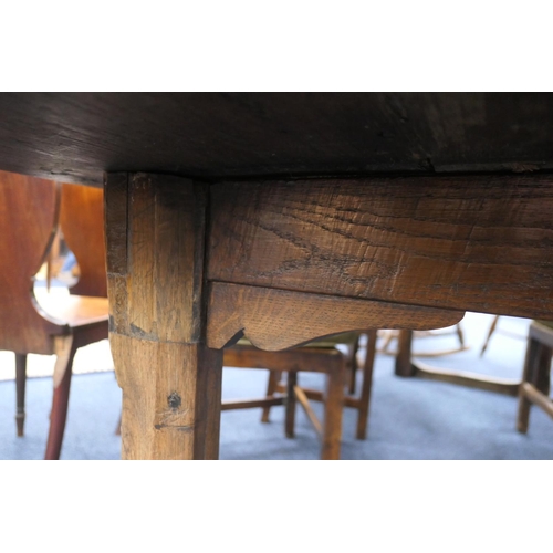 556 - Oak refectory table, Mid 17th Century and later, three plank top patinated and with some old graffit... 