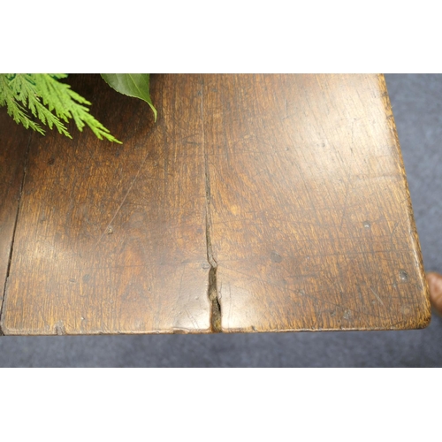 556 - Oak refectory table, Mid 17th Century and later, three plank top patinated and with some old graffit... 