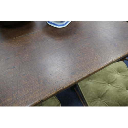 556 - Oak refectory table, Mid 17th Century and later, three plank top patinated and with some old graffit... 