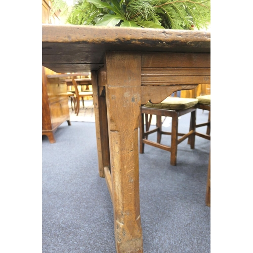 556 - Oak refectory table, Mid 17th Century and later, three plank top patinated and with some old graffit... 