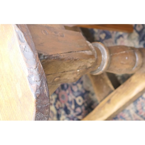 554 - Oak refectory table in 17th Century style, two plank top over turned baluster legs, united by an H-s... 