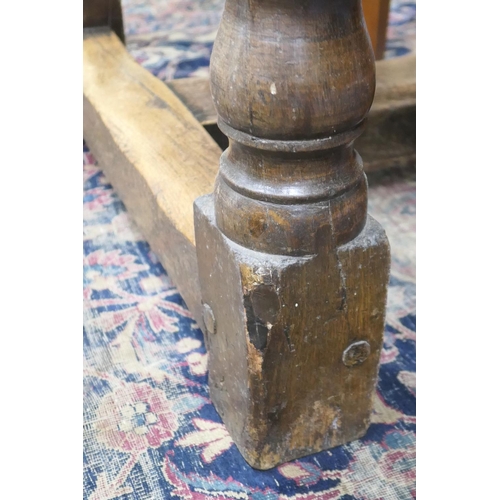 554 - Oak refectory table in 17th Century style, two plank top over turned baluster legs, united by an H-s... 