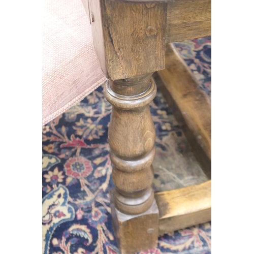 554 - Oak refectory table in 17th Century style, two plank top over turned baluster legs, united by an H-s... 