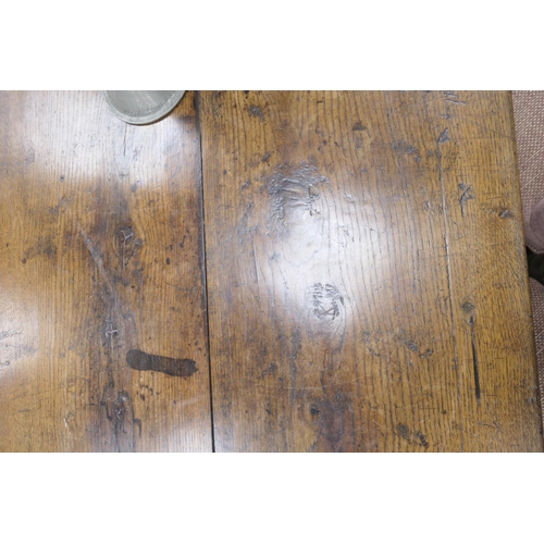 554 - Oak refectory table in 17th Century style, two plank top over turned baluster legs, united by an H-s... 