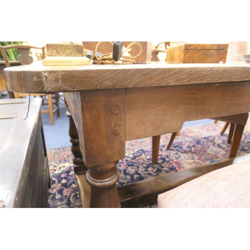 554 - Oak refectory table in 17th Century style, two plank top over turned baluster legs, united by an H-s... 