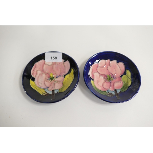 158 - Two Moorcroft magnolia blue ground pin dishes (seconds), 11.5cm