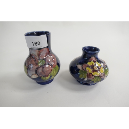 160 - Moorcroft clematis blue ground small baluster vase with Queen Mary paper label, height 11cm; also a ... 