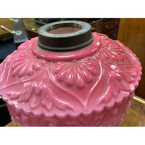 483 - Victorian cast iron and pink moulded glass pedestal oil lamp, also a brass Corinthian column oil lam... 