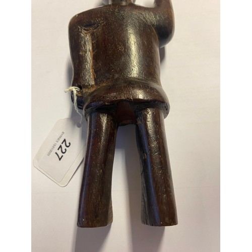 227 - Primitive carved wooden figure, probably 19th Century, 21cm