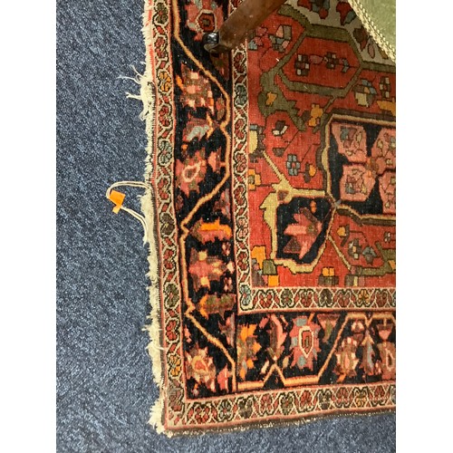 381 - Hamadan red and fawn ground woollen rug, circa 1900, 200cm x 134cm