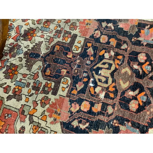 381 - Hamadan red and fawn ground woollen rug, circa 1900, 200cm x 134cm