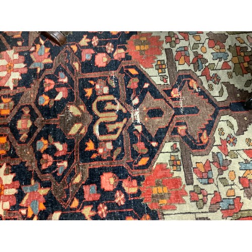 381 - Hamadan red and fawn ground woollen rug, circa 1900, 200cm x 134cm