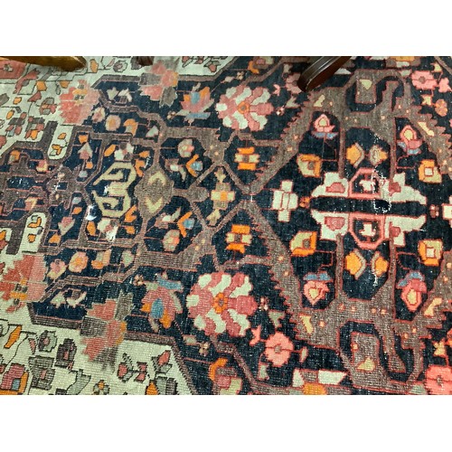 381 - Hamadan red and fawn ground woollen rug, circa 1900, 200cm x 134cm