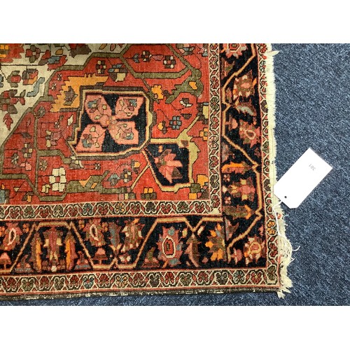 381 - Hamadan red and fawn ground woollen rug, circa 1900, 200cm x 134cm