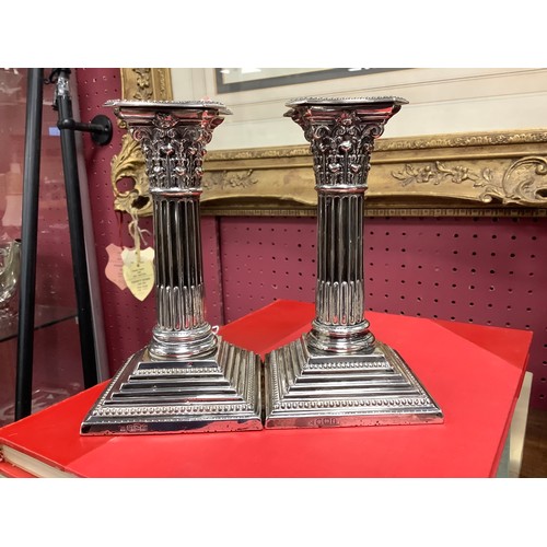 252 - Pair of Victorian silver Corinthian column dwarf candlesticks, Sheffield 1899, height 16cm (loaded)