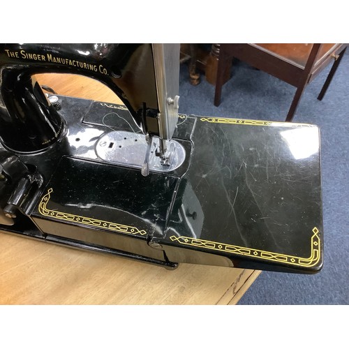 447 - Singer portable electric sewing machine, number 221K, with carrying case, foot pedal and instruction... 