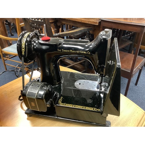 447 - Singer portable electric sewing machine, number 221K, with carrying case, foot pedal and instruction... 